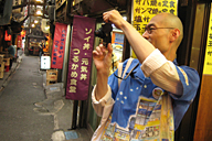 taking pictures of shops by all people there together